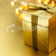 stock-photo-14400184-christmas-gift-on-gold-background